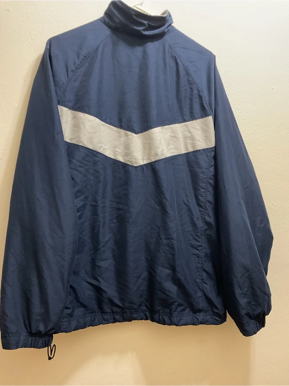 Vintage Nike Men’s Navy Blue Windbreaker with White Chest Stripe
